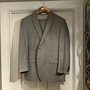 Men’s Calvin Klein suit. Tailored, approximately W34, Length 32. Jacket 32 L.